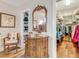 Bedroom with walk-in closets, decorative vanity and beautiful laminate floors at 203 Prestwick Dr, New Smyrna Beach, FL 32168