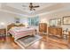 Spacious main bedroom with a tray ceiling, providing a serene and relaxing retreat at 203 Prestwick Dr, New Smyrna Beach, FL 32168