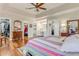 Large main bedroom with tray ceilings, walk-in closet, dressing table and ensuite bathroom at 203 Prestwick Dr, New Smyrna Beach, FL 32168