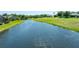 A serene water view from the property, adding a touch of nature and tranquility at 203 Prestwick Dr, New Smyrna Beach, FL 32168