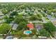 A neighborhood aerial showcasing lush trees and houses, some featuring private pools on spacious lots at 222 Yarmouth Rd, Fern Park, FL 32730
