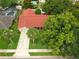 Aerial view of a charming home showcasing its roof, driveway, and mature trees at 222 Yarmouth Rd, Fern Park, FL 32730