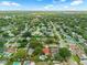 Expansive aerial view of a residential neighborhood with lush trees and sparkling pools at 222 Yarmouth Rd, Fern Park, FL 32730