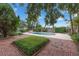 Beautiful backyard with a brick patio, manicured greenery, and a sparkling pool at 222 Yarmouth Rd, Fern Park, FL 32730