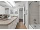 Bathroom featuring a shower, granite countertops, and neutral tile flooring at 222 Yarmouth Rd, Fern Park, FL 32730