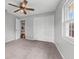 Bedroom featuring a ceiling fan, plush carpet, closet and a bright window at 222 Yarmouth Rd, Fern Park, FL 32730