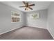 Bedroom featuring a ceiling fan, plush carpet, and a bright window at 222 Yarmouth Rd, Fern Park, FL 32730