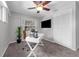Cozy bedroom featuring a ceiling fan, plush carpet, and a bright window with a white writing desk at 222 Yarmouth Rd, Fern Park, FL 32730