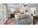 Comfortable bedroom with a ceiling fan, wooden accents, and natural light at 222 Yarmouth Rd, Fern Park, FL 32730