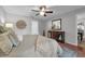 Comfortable bedroom with a ceiling fan, wooden accents, and natural light at 222 Yarmouth Rd, Fern Park, FL 32730