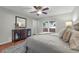 Comfortable bedroom with a ceiling fan, wooden accents, and natural light at 222 Yarmouth Rd, Fern Park, FL 32730