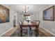 Elegant dining room with a large wooden table, decorative rug, and chandelier lighting at 222 Yarmouth Rd, Fern Park, FL 32730