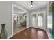 Welcoming foyer with decorative front doors, views of living room, and tile flooring at 222 Yarmouth Rd, Fern Park, FL 32730