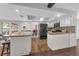 Bright kitchen with white cabinets, black appliances, and bar top seating at 222 Yarmouth Rd, Fern Park, FL 32730