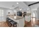 Bright kitchen with white cabinets, black appliances, and bar top seating at 222 Yarmouth Rd, Fern Park, FL 32730