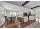 Bright open-concept kitchen and dining area featuring an island with bar seating at 222 Yarmouth Rd, Fern Park, FL 32730