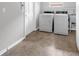 Laundry room with neutral tile flooring, washer, dryer and window at 222 Yarmouth Rd, Fern Park, FL 32730