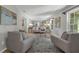 Bright living room with neutral tones, tile flooring, and stylish furnishings at 222 Yarmouth Rd, Fern Park, FL 32730