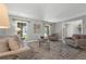 Cozy living room featuring a comfortable sofa, two chairs, and natural lighting at 222 Yarmouth Rd, Fern Park, FL 32730