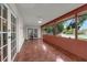 Large, tiled patio features a ceiling fan and views of the backyard and pool at 222 Yarmouth Rd, Fern Park, FL 32730