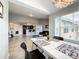 Bright dining area with modern table and chairs, adjacent to a spacious living room and kitchen at 4103 Tropical Isle Blvd # 132, Kissimmee, FL 34741