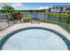 Inviting in-ground hot tub with a view of the water at 4103 Tropical Isle Blvd # 132, Kissimmee, FL 34741