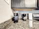 Close up of kitchen counter with coffee maker, sleek gray backsplash, and granite countertops at 4103 Tropical Isle Blvd # 132, Kissimmee, FL 34741