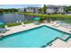Community swimming pool, surrounded by lounge chairs and well-maintained landscaping at 4103 Tropical Isle Blvd # 132, Kissimmee, FL 34741