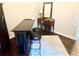 An inviting bar area with stools and a classic mirror, perfect for entertaining at 750 Hempstead Ave, Orlando, FL 32803