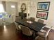 Formal dining room with elegant chandelier and table with seating for six at 750 Hempstead Ave, Orlando, FL 32803