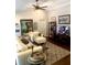 A cozy living room with high ceilings, a ceiling fan, and lots of natural light at 750 Hempstead Ave, Orlando, FL 32803