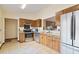 Functional kitchen with stainless steel appliances and wooden cabinets at 1037 Parnell Ct, Deltona, FL 32738
