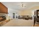 Spacious living room featuring a stone fireplace and comfortable seating at 1037 Parnell Ct, Deltona, FL 32738