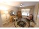 Charming bedroom featuring a vanity, elegant decor, and a comfortable, inviting atmosphere at 1669 Plum Branch Ter, The Villages, FL 32162
