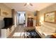 Open-concept living room featuring stylish furniture, modern decor, and an inviting atmosphere at 1669 Plum Branch Ter, The Villages, FL 32162