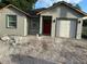 Charming new home with a red door and a one car garage at 2451 W 18Th St, Sanford, FL 32771