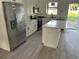 Modern kitchen with stainless steel appliances and a center island at 2451 W 18Th St, Sanford, FL 32771