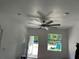 Bright living room featuring ceiling fan and window with outdoor view at 2451 W 18Th St, Sanford, FL 32771