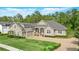 Beautiful single Gathering home featuring a well-manicured lawn and a circular driveway at 452 Raccoon St, Lake Mary, FL 32746