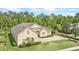 Charming one-story home with a landscaped yard and a circular driveway nestled among trees at 452 Raccoon St, Lake Mary, FL 32746