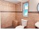 Bathroom featuring custom tile, toilet, and walk-in shower at 7808 The Esplanade Ct, Orlando, FL 32836
