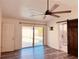 Bright bedroom with sliding glass doors to pool and modern ceiling fan at 7808 The Esplanade Ct, Orlando, FL 32836