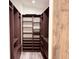 Custom walk-in closet with built in shelving and drawers at 7808 The Esplanade Ct, Orlando, FL 32836