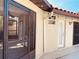 Exterior view of enclosed porch showing sink, cabinet, and screen door for indoor outdoor living at 7808 The Esplanade Ct, Orlando, FL 32836