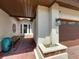 Inviting front porch with brick pavers, a cozy bench, and elegant entryway details at 7808 The Esplanade Ct, Orlando, FL 32836