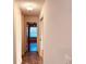 Hallway view leading to a room with natural light streaming through the window at 7808 The Esplanade Ct, Orlando, FL 32836