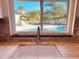 Kitchen sink view overlooking a private pool and lush tropical landscaping, bringing the outdoors in at 7808 The Esplanade Ct, Orlando, FL 32836