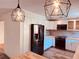 This kitchen boasts butcher block counters, stainless appliances, modern lighting, and white cabinetry at 7808 The Esplanade Ct, Orlando, FL 32836