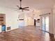 Bright and open living space with a ceiling fan, wood-look floors, and sliding glass door at 7808 The Esplanade Ct, Orlando, FL 32836
