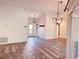 Spacious living room featuring wood floors, modern lighting, and lots of natural light at 7808 The Esplanade Ct, Orlando, FL 32836